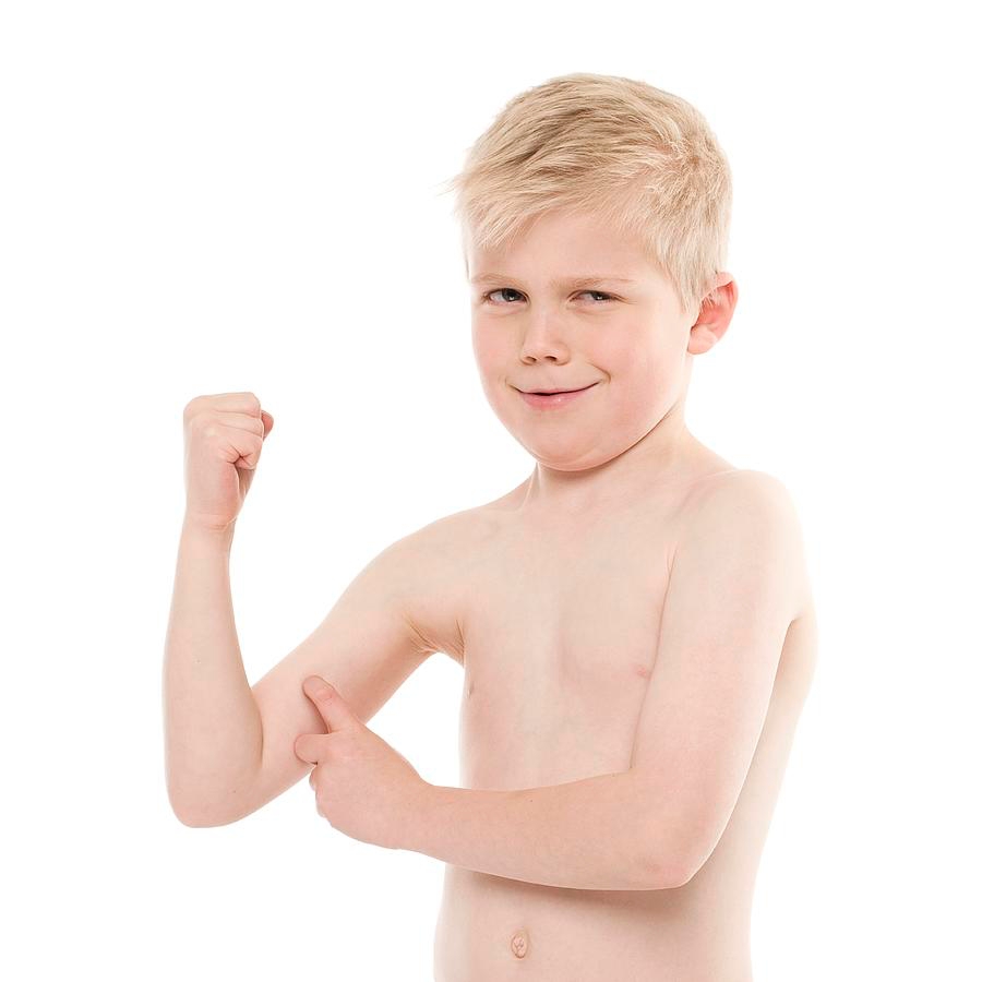 Stock image of a boy flexing his muscles