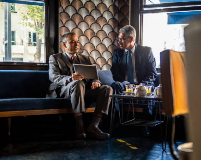 two businessmen in a coffee shop