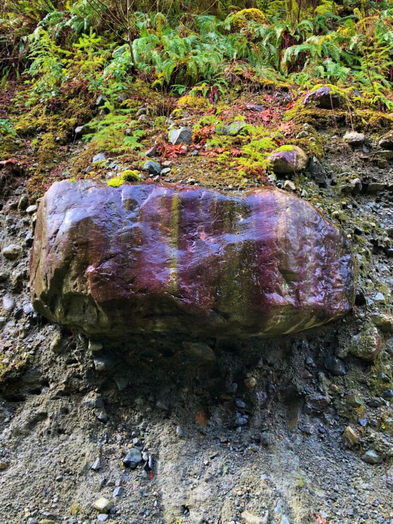 brightly coloured striped boulder