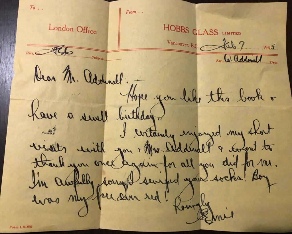 Handwritten 1945 note on yellow Hobbs Glass Limited letterhead from Vancouver, B.C. The writer hopes Mr. Addinall likes the book, wishes him a swell birthday, thanks him for his visits, and apologizes for swiping his socks.